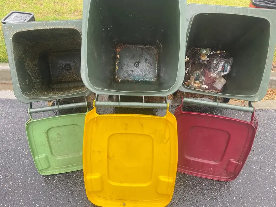 Three wheelie bins grimy inside before a clean